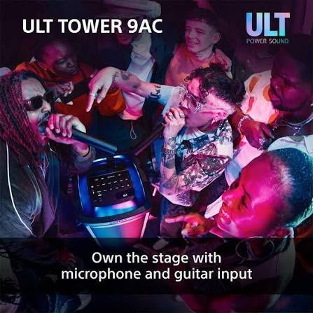 People gathered around the Sony ULT TOWER 9AC with a microphone